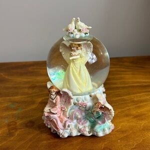 Angel music box 1980s box musical wind up still works. No flaws